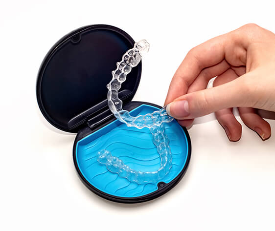 Transparent aligners and storage case. Invisible braces. Clear teeth straighteners. Plastic bracers