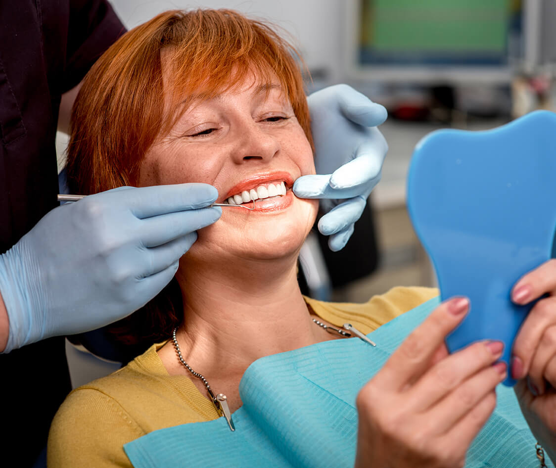 Senior woman in the dental office.